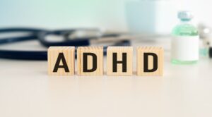 “ADHD” written on small wooden blocks